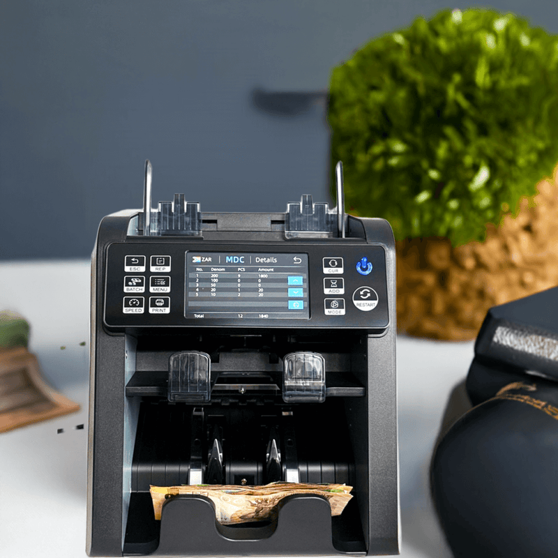 mixed note counting machine on cash up desk