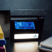 UV and white light counterfeit detector